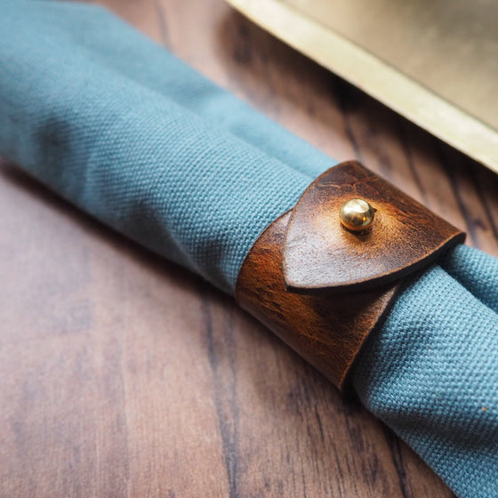 Close-up view on the rust napkin ring showcasing the luxurious view and feel of the napkin ring.
