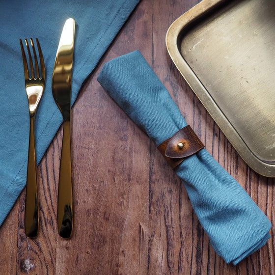 A luxury napkin ring offering from HÔRD Leather; featuring the Rust Napkin Ring.