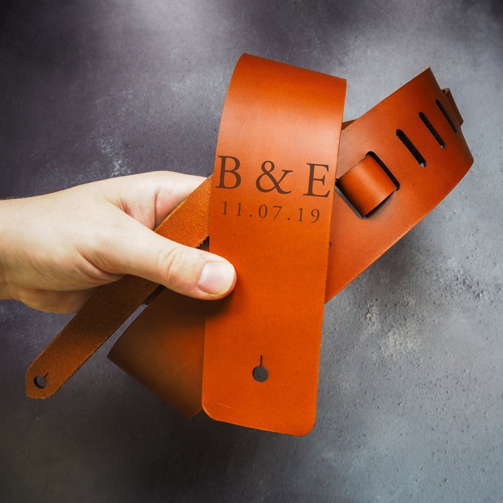 Full view of the Personalised Thick Leather Guitar Strap in tan with custom initials and dates by HÔRD.