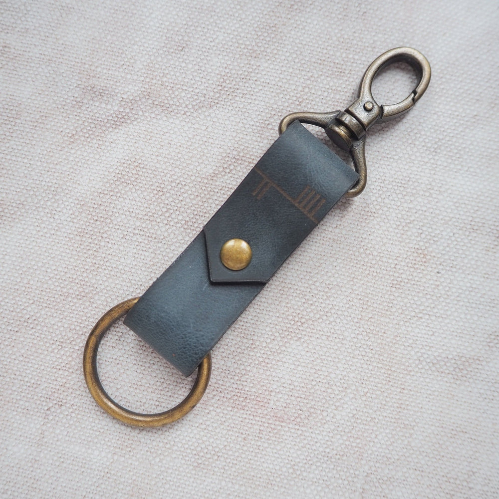
                  
                    The Celtic Tree Alphabet Key Fob, a personalised leather key fob from HÔRD.
                  
                