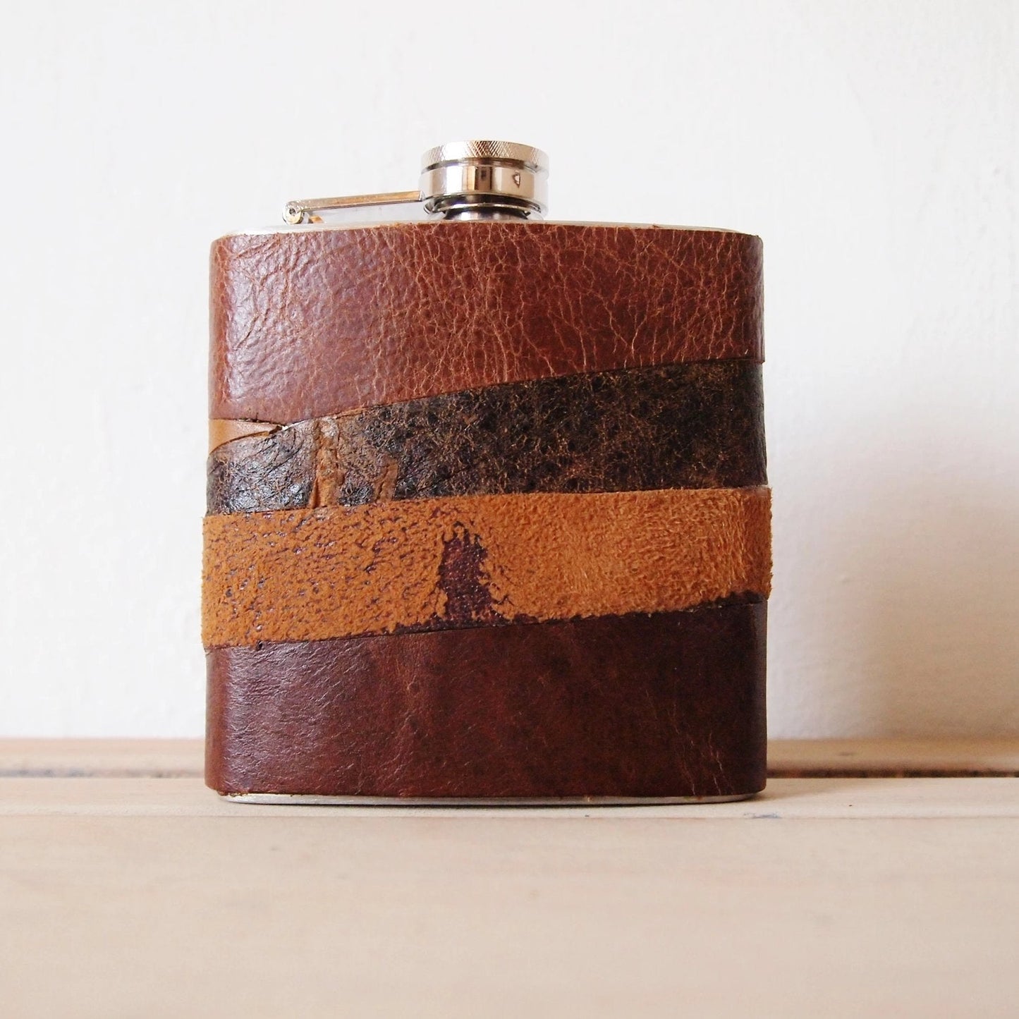 The Distressed Leather Flask, a rum flask by Hord.