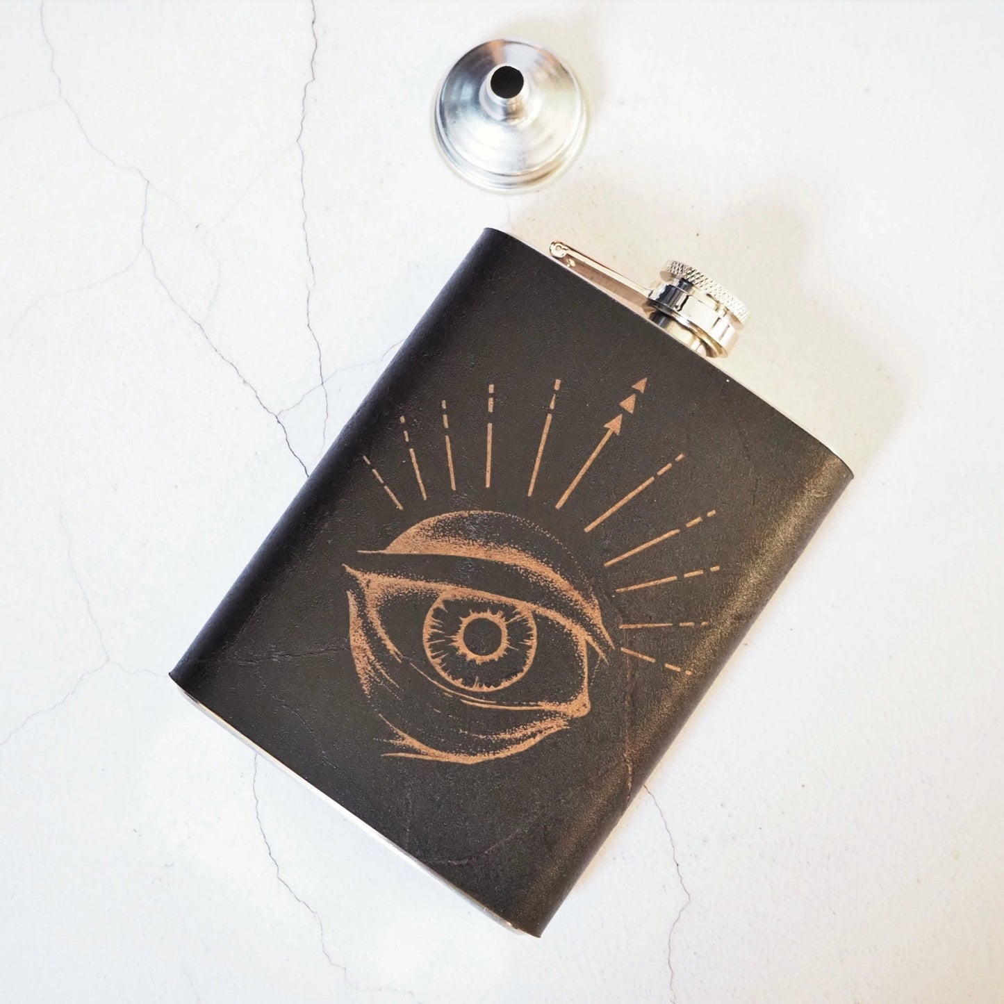 The Eye of Odin Flask, a custom whiskey flask from Hord.