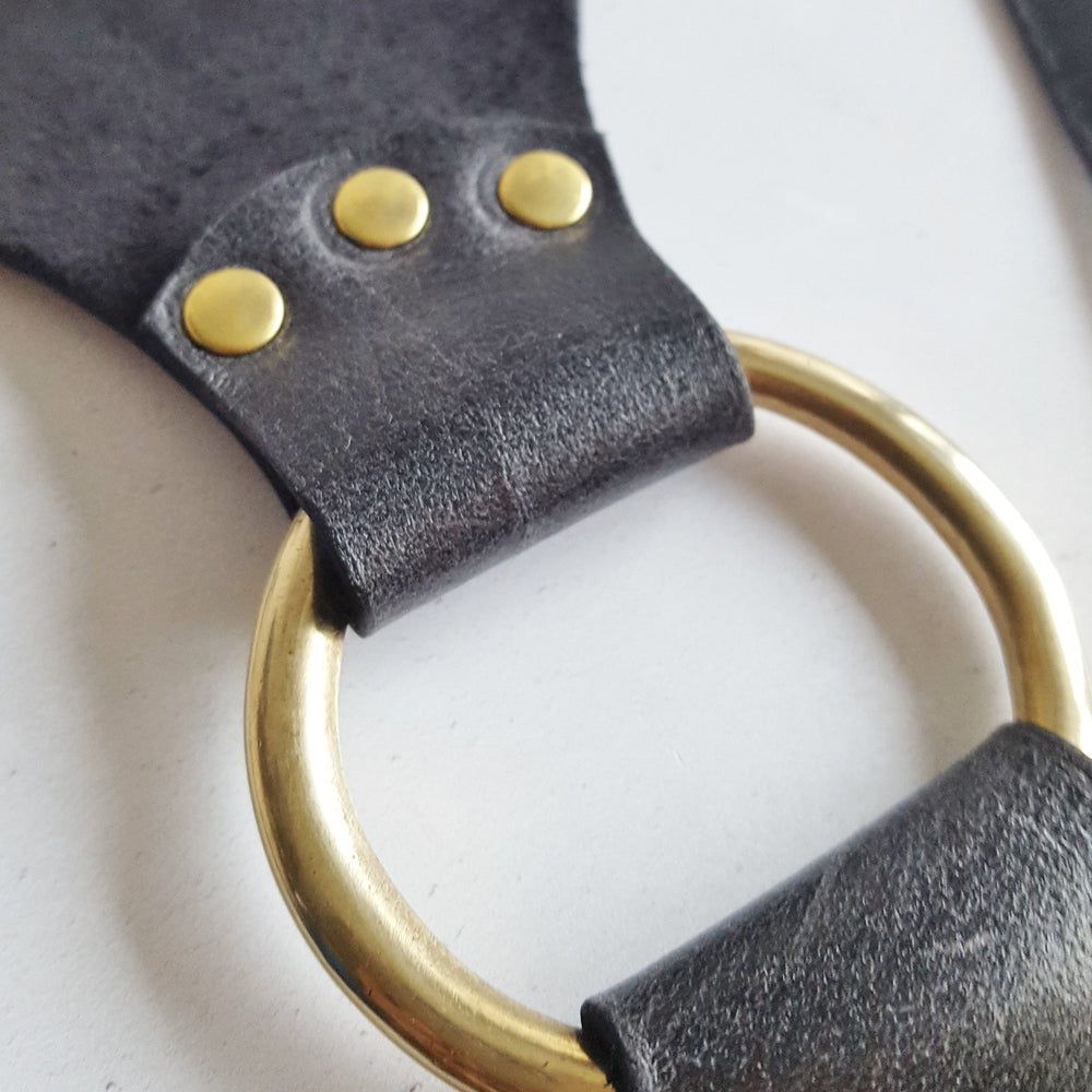 
                  
                    Hardware used in the leather chest harness.
                  
                