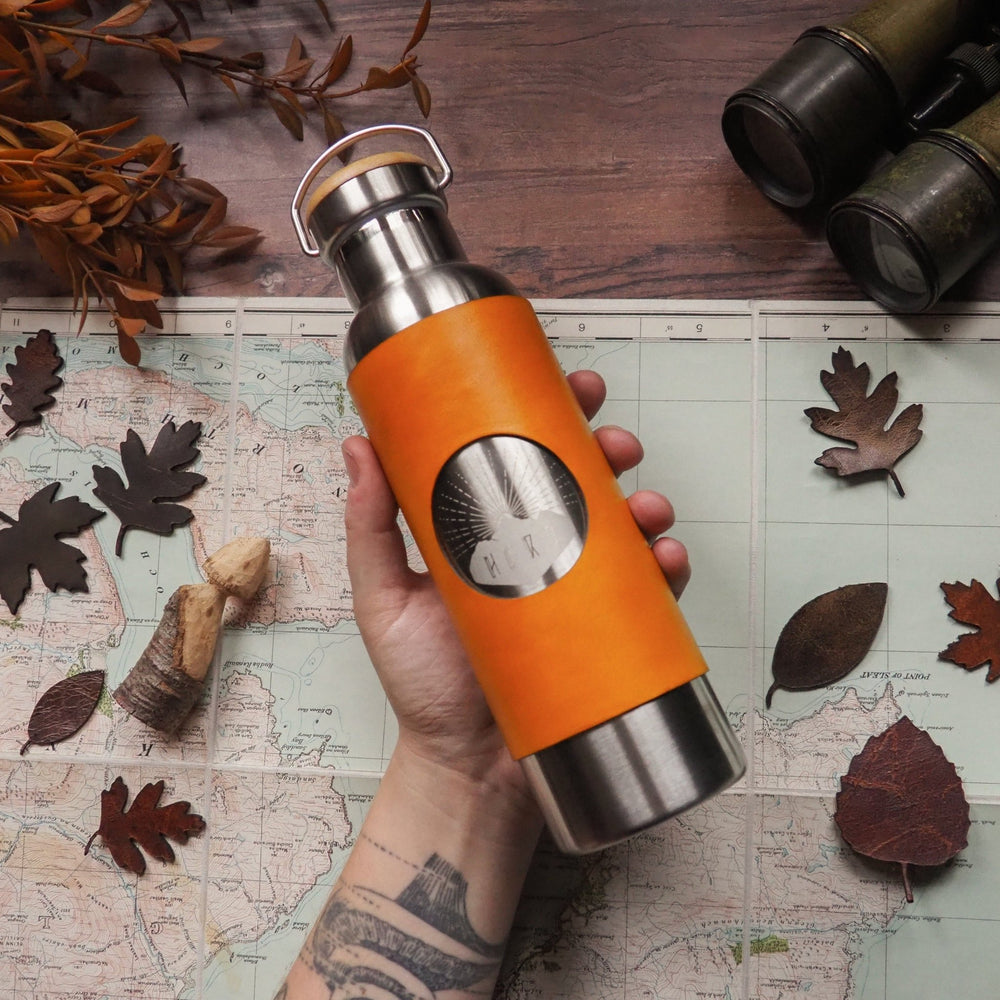 This leather wrapped personalised insulated water bottle is in yellow leather colour. 