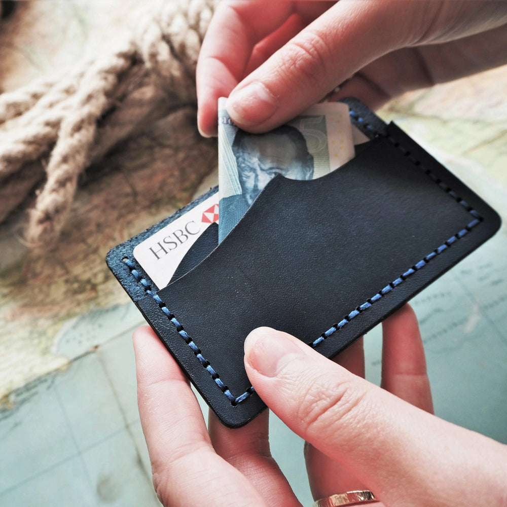 
                  
                    THis full grain leather card holder has 2 compartments and can hold a deceptive amount of cards and cash.
                  
                