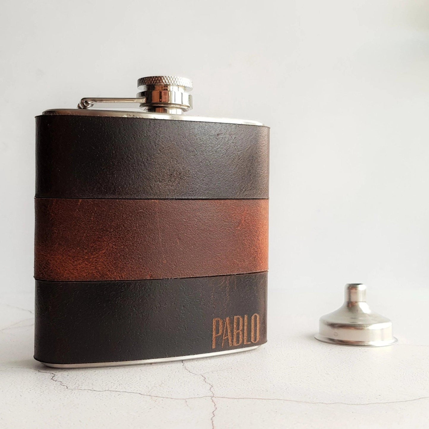 The Peat and Rust Leather Flask, a designer flask from Hôrd. 