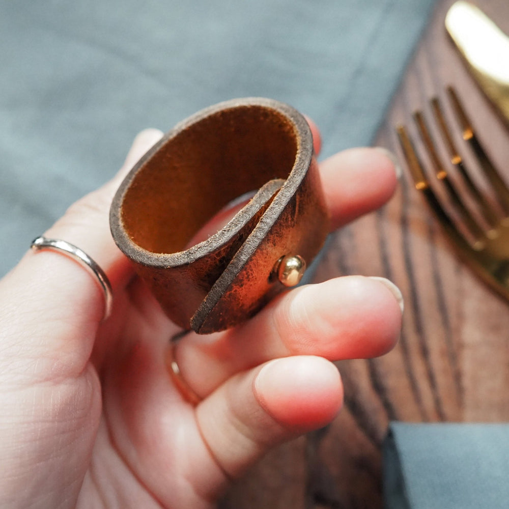
                  
                    Full view of the Rust Napkin Ring, a luxury napkin ring offering from HÔRD.
                  
                