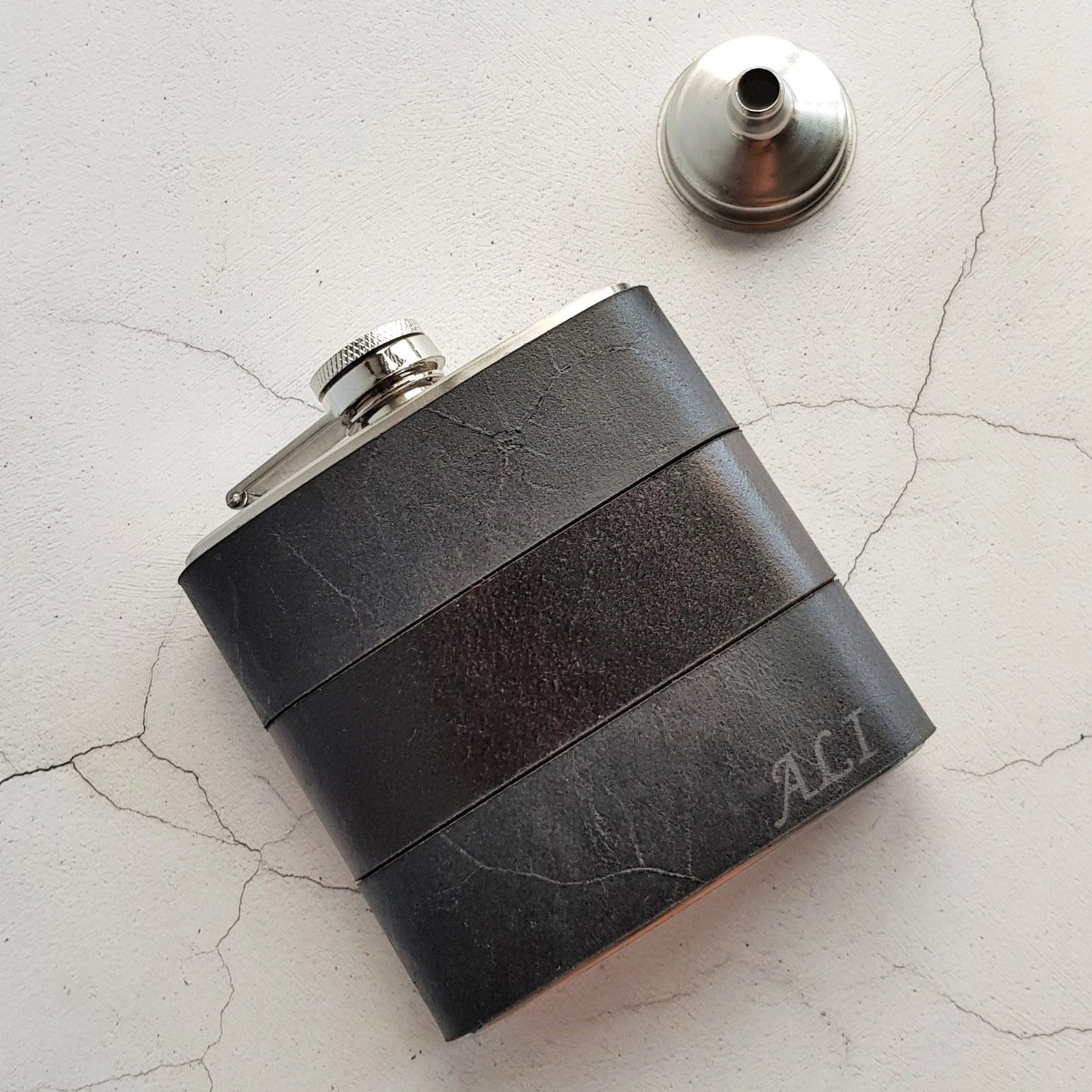 The Smoke and Peat Leather Flask, a custom leather hip flask form Hôrd.