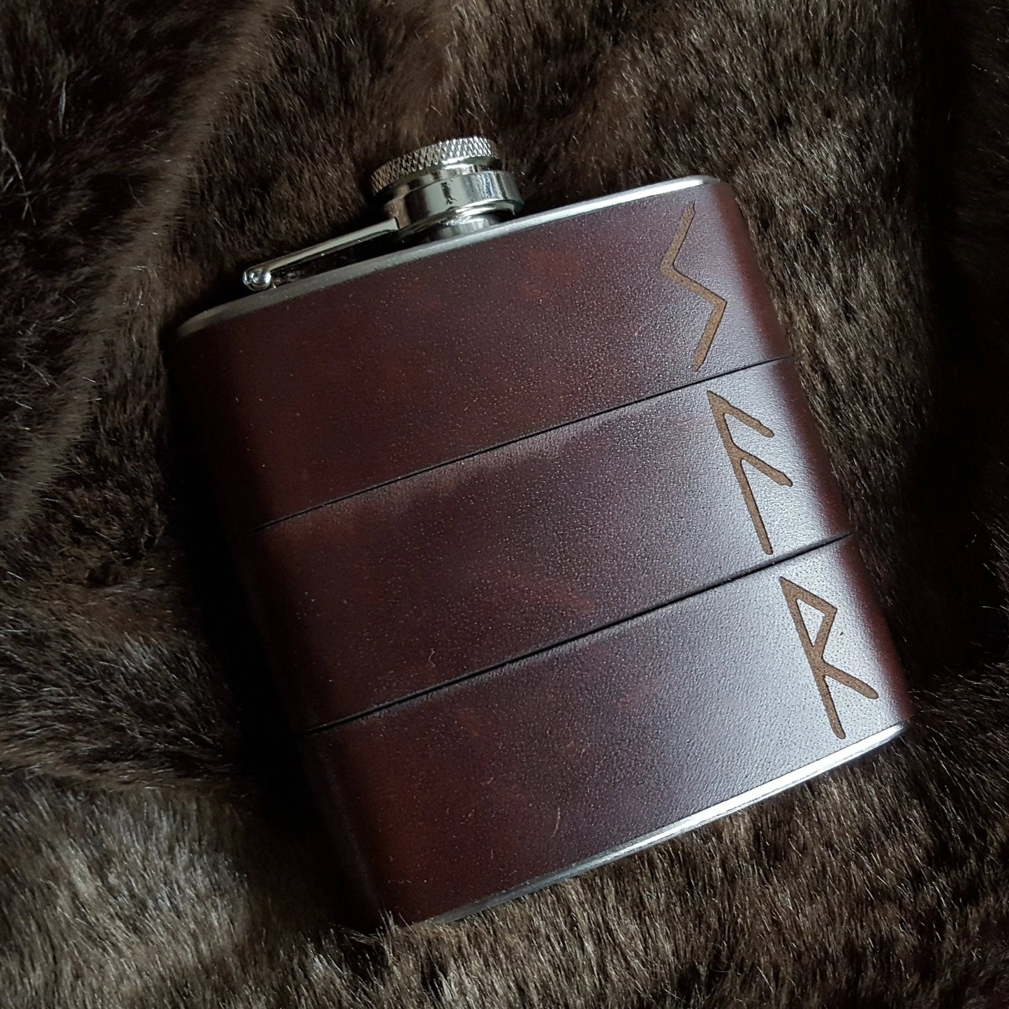 The Viking Rune Hip Flask featuring the norse runes engraved onto the .flask