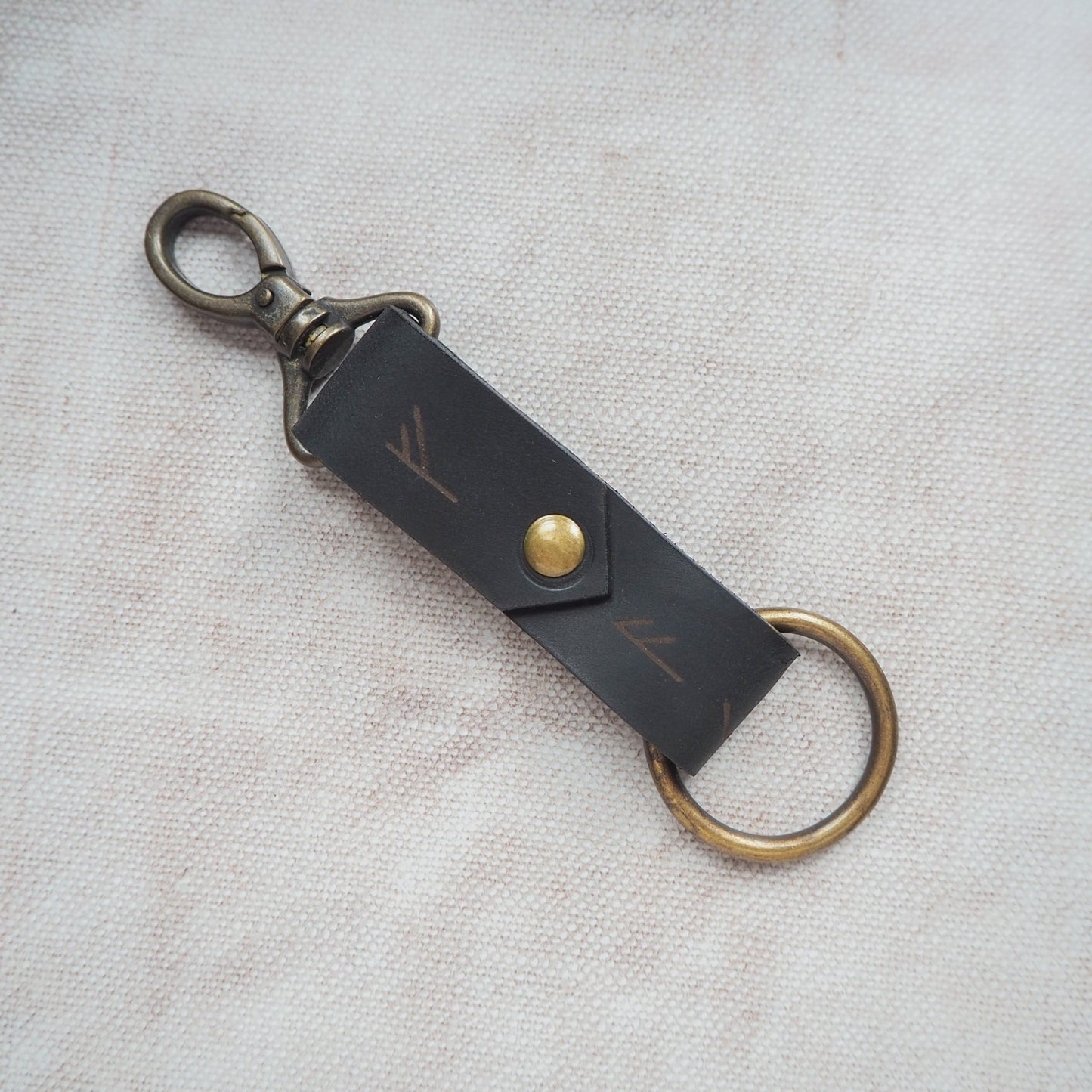 A custom keyring featuring the viking rune engraving.